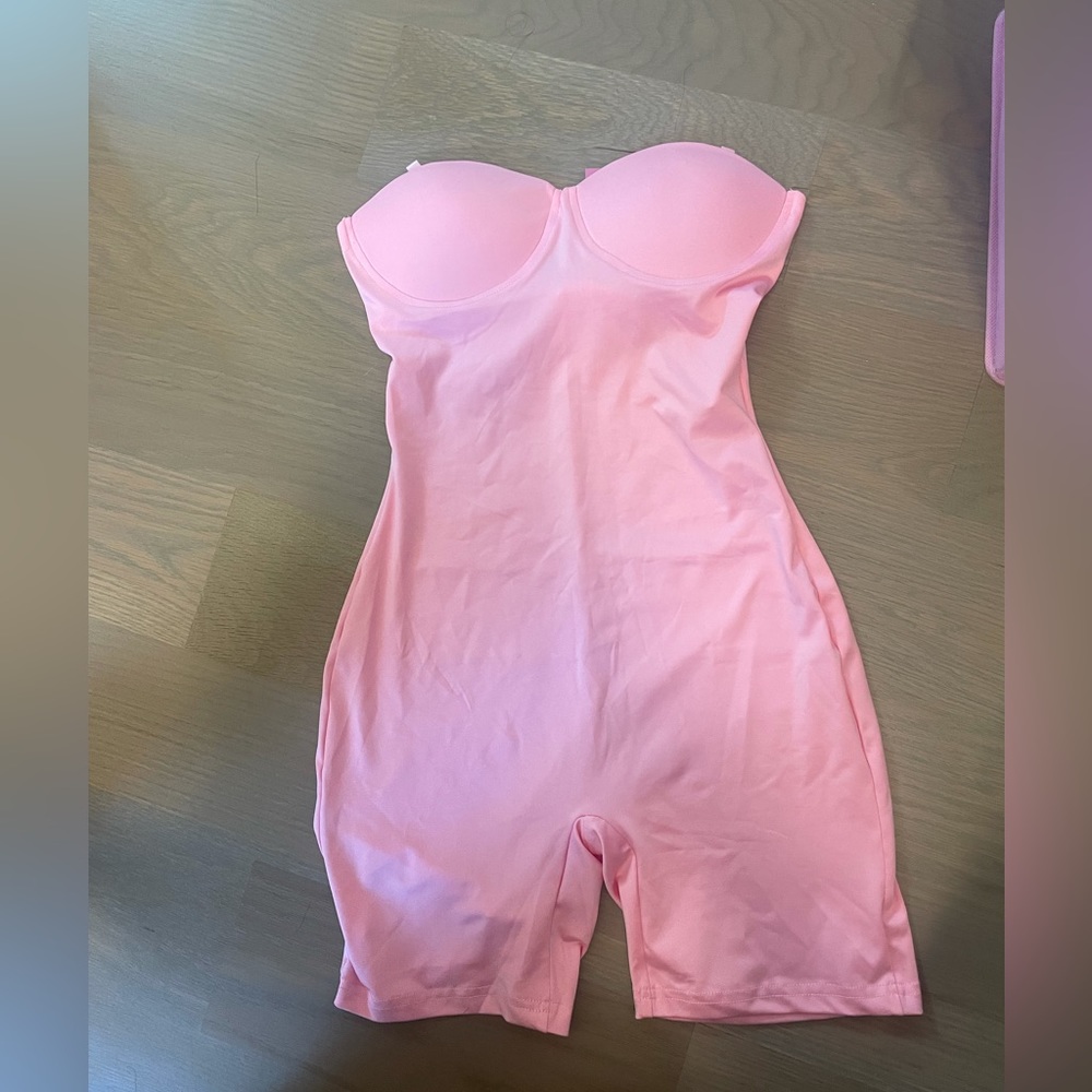 Women’s pink onesie active romper. Brand new with tags. Size small.